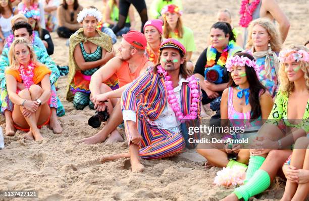 People share a moment of quiet reflection at Bondi Beach on March 22, 2019 in Sydney, Australia. Surfers gather to celebrate five years of OneWave, a...