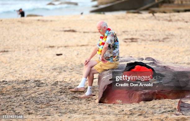 Man has a moment of quiet reflection at Bondi Beach on March 22, 2019 in Sydney, Australia. Surfers gather to celebrate five years of OneWave, a not...