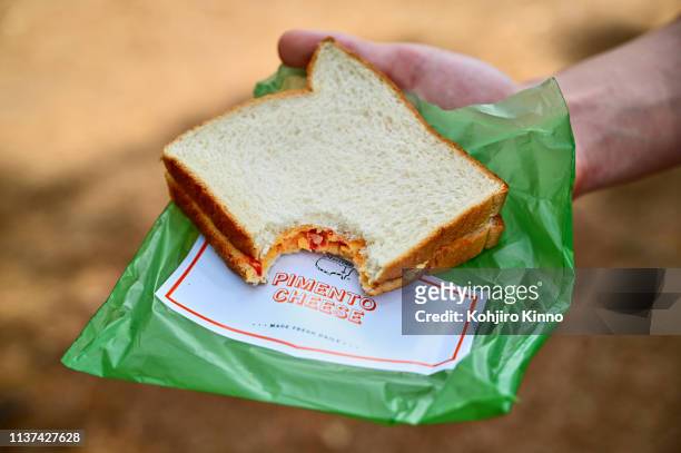 Closeup view of a once bitten pimento cheese sandwich during Thursday play at Augusta National. Augusta, GA 4/11/2019 CREDIT: Kohjiro Kinno
