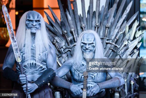 April 2019, Hamburg: Two men dressed up as "White Walkers", known from the fantasy series "Game of Thrones", are to be seen in the evening at the...
