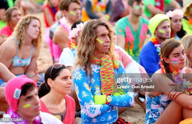 People look on solemnly as One Wave founder Grant Treblico addresses the crowd on March 22, 2019 in Sydney, Australia. Surfers gather to celebrate...