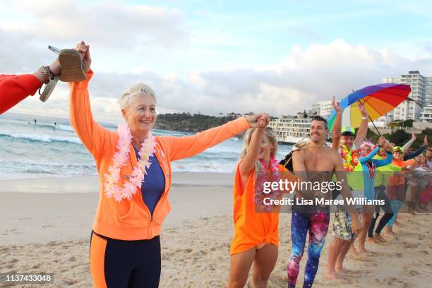 Dr Kerryn Phelps links hands with surfers in solidarity with OneWave at sunrise on Bondi Beach on March 22, 2019 in Sydney, Australia. Surfers gather...