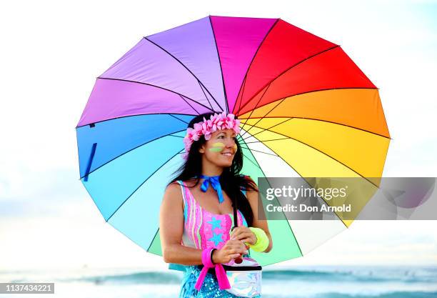 Fluro clad Jodi Hooker poses on the Bondi Beach shoreline on March 22, 2019 in Sydney, Australia. Surfers gather to celebrate five years of OneWave,...
