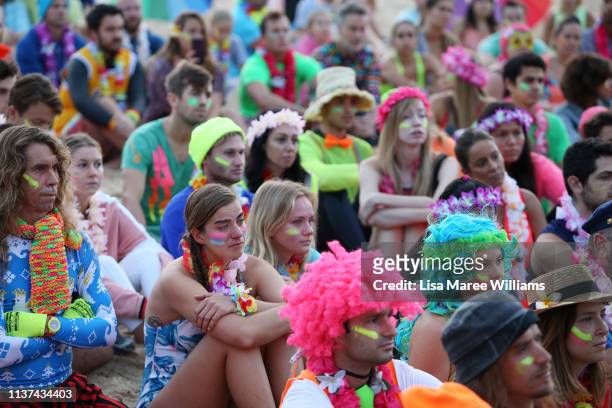 Crowds dress in colour in solidarity with OneWave at sunrise on Bondi Beach on March 22, 2019 in Sydney, Australia. Surfers gather to celebrate five...