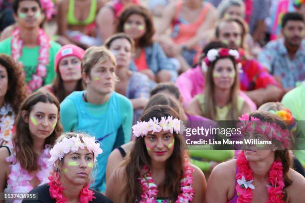 Crowds dress in colour in solidarity with OneWave at sunrise on Bondi Beach on March 22, 2019 in Sydney, Australia. Surfers gather to celebrate five...