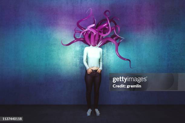 abstract tentacle woman against concrete wall - tentacle imagens e fotografias de stock