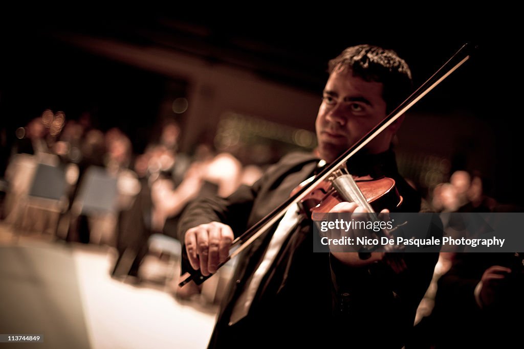 One man playing a violin