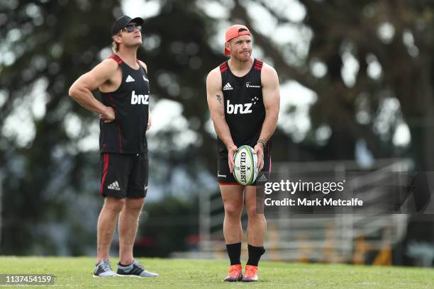 Crusaders coach Scott Robertson watches Ryan Crotty kick a Crusaders Super Rugby training session at Scots College on March 22, 2019 in Sydney,...