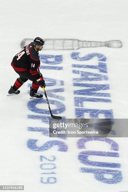 Carolina Hurricanes right wing Justin Williams skates the puck up ice during a game between the Carolina Hurricanes and the Washington Capitals at...