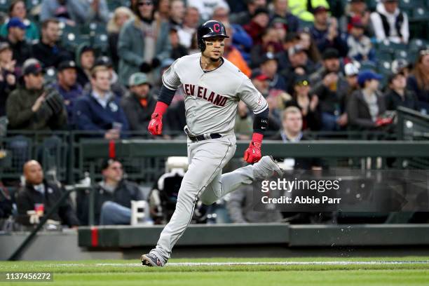 Carlos Gonzalez of the Cleveland Indians scores on a single off the bat of Hanley Ramirez in the first inning against the Seattle Mariners during a...