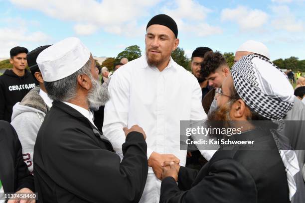 New Zealand All Blacks rugby player Sonny Bill Williams greets members of the Muslim community after attending islamic prayers in Hagley Park near Al...