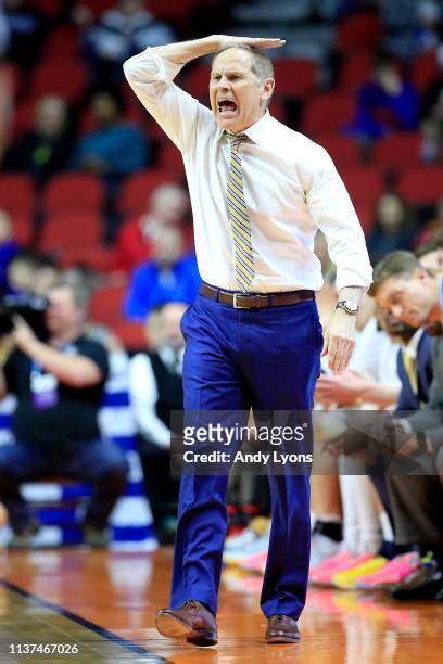 Head coach John Beilein of the Michigan Wolverines instructs his team against the Montana Grizzlies in the second half during the first round of the...