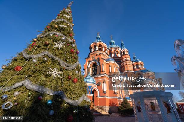 exteria of kasan church with christmas tree in front in irkutsk, russia - kazan stock pictures, royalty-free photos & images