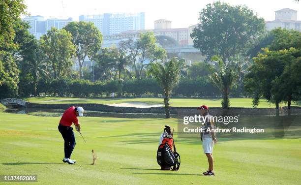 Gavin Green of Malaysia plays his second shot on the 13th hole on Day Two of the Maybank Championship at at Saujana Golf & Country Club, Palm Course...