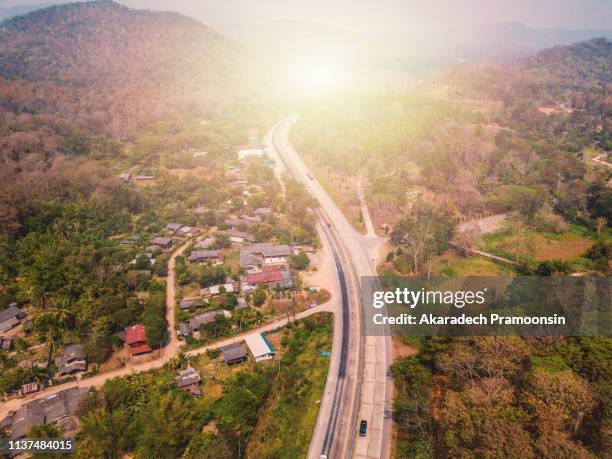 aerial view of highway and forest thailand - 4k解像度 ストックフォトと画像