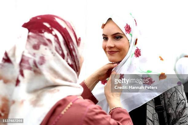Muslim woman gives away a free hijab to guests attending the Ponsonby Masjid Mosque during an open service to all religions on March 22, 2019 in...