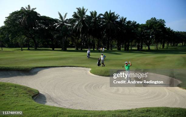 Shiv Kapur of India plays his second shot on the 13th hole on Day Two of the Maybank Championship at at Saujana Golf & Country Club, Palm Course on...