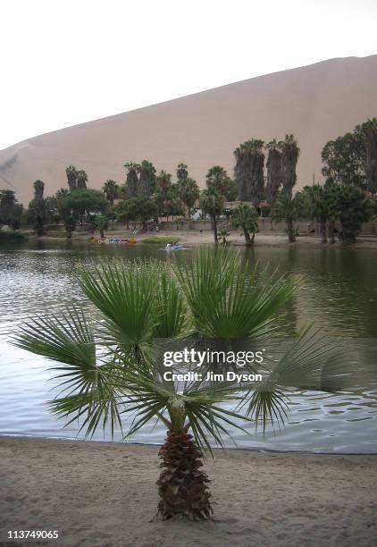 View of the lake at the desert oasis of Huacachina on March 8, 2005 in Huacachina, Peru. The village, and surrounding desert, in the Ica Region is a...