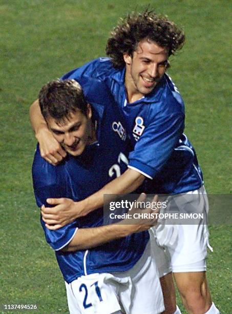 Italian Christian Vieri is congratulated by teammate Alessandro Del Piero after scoring the third goal for the Italian side 17 June at the Stade de...