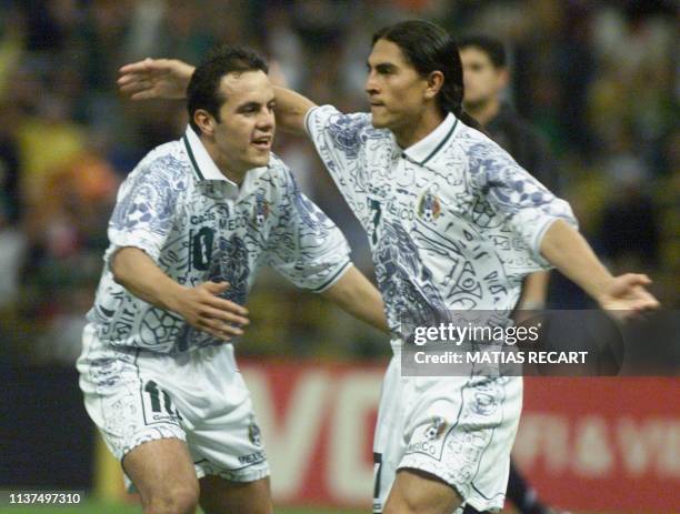 Cuauhtemoc Blanco of Mexico embraces teammate Francisco Palencia during their FIFA Confederation Cup match against Bolivia 29 July 1999 in Mexico...
