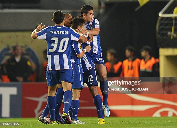 Porto's players celebrate after scoring during the UEFA Europa League semi-final second leg football match between Villarreal and Porto at the...