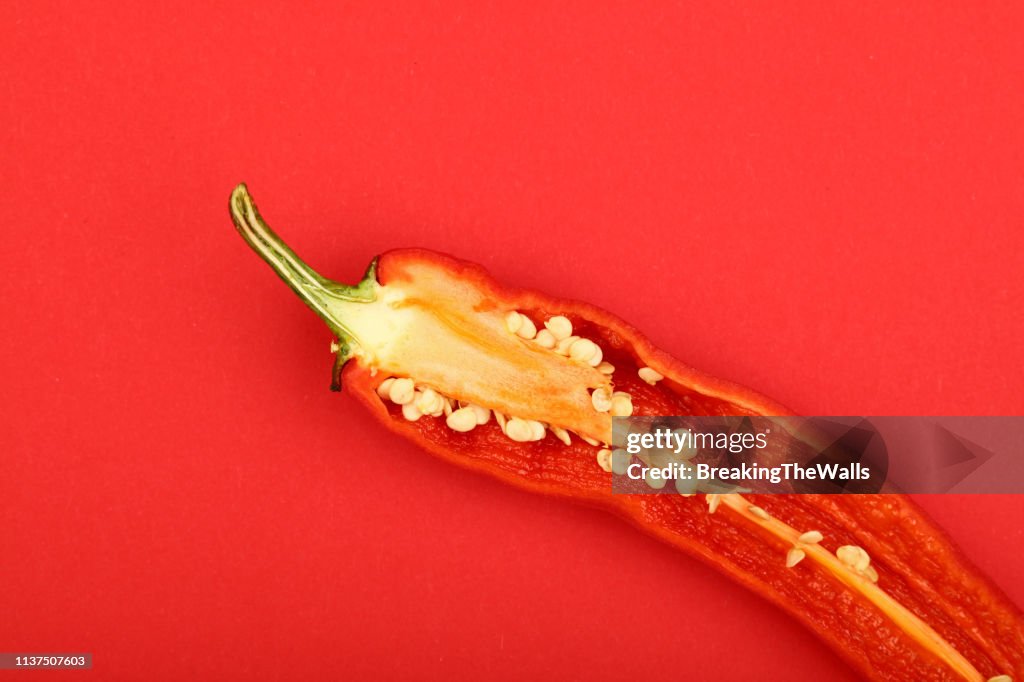 Close-Up Of Jalapeno Pepper Against Red Background