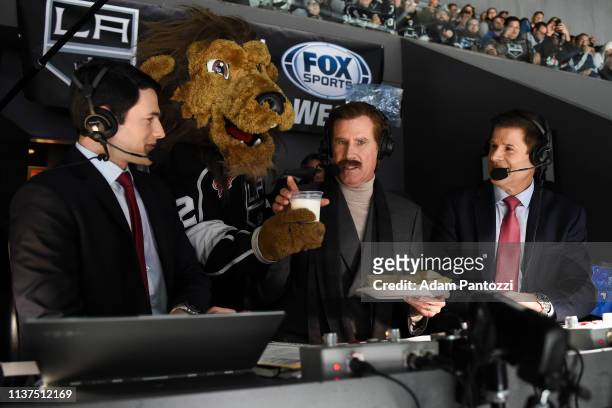 Actor Will Ferrell, in character as Ron Burgundy, is delivered a glass of milk and a burrito by Los Angeles Kings mascot Bailey as Ferrell calls the...