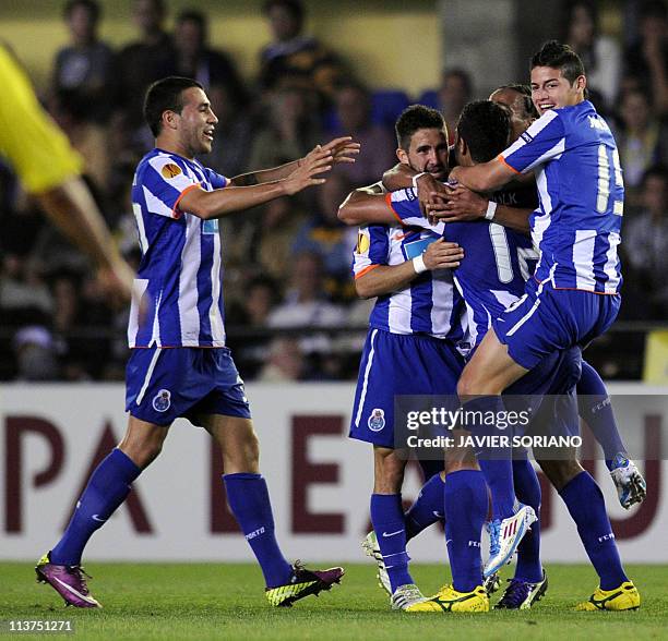 Porto's players celebrate after scoring during the UEFA Europa League semi-final second leg football match between Villarreal and Porto at the...