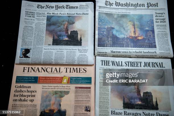 The US Newspapers editions of the New York Times, The Washington Post, The Wall Street Journal and the Financial Times display images of Notre-Dame...