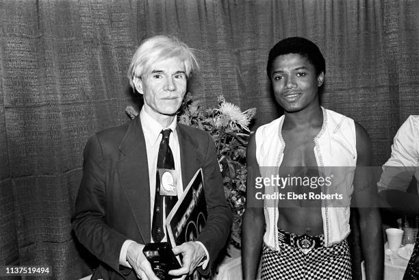 American pop artist Andy Warhol with musician Randy Jackson, backstage at Madison Square Garden in New York City on August 19, 1981.