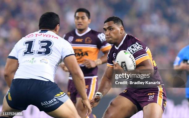 Tevita Pangai Junior of the Broncos takes on the defence of Jason Taumalolo of the Cowboys during the round two NRL match between the Brisbane...