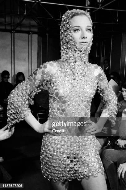 Picture taken on January 29, 1969 at Paris showing a fashion model wearing a plastic and metal dress created by Paco Rabanne for his Summer 1969...