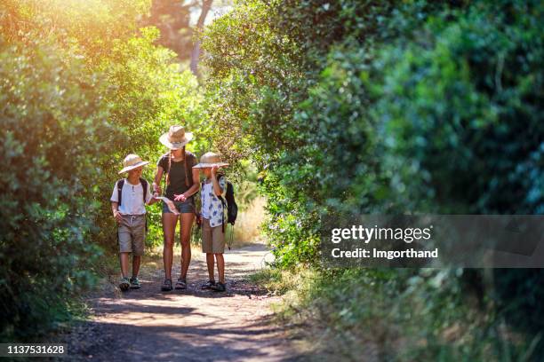 kids enjoying treasure hunt adventure - treasure hunt outside stock pictures, royalty-free photos & images