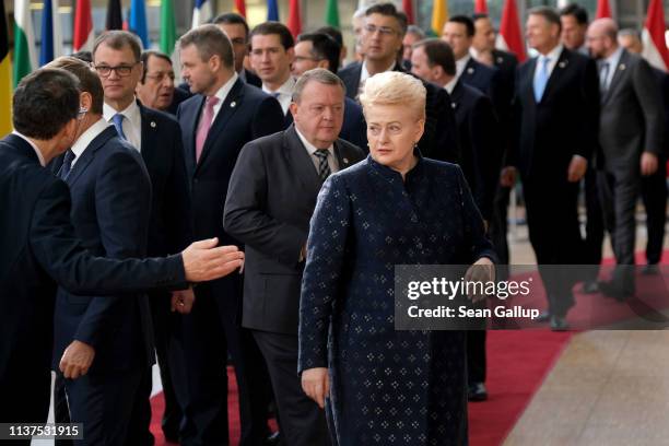 European leaders including Lithuanian President Dalia Grybauskaite arrive for the family photo during a celebration to mark the 25th anniversary of...