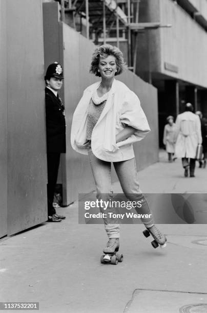 British actress and singer Sarah Payne on roller skates in London, UK, 6th May 1984.