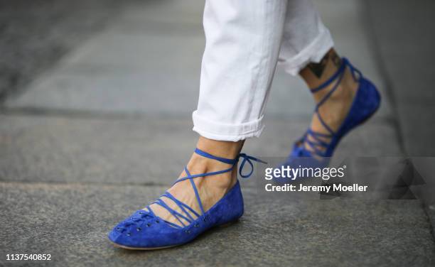 Masha Sedgwick wearing white Zara mom jeans, royal blue Santoni ballerina shoes on March 20, 2019 in Berlin, Germany.