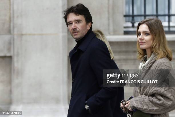 Member of the board of directors of LVMH Antoine Arnault and his partner Natalia Vodianova arrive at Notre-Dame-de Paris Cathedral a day after a fire...