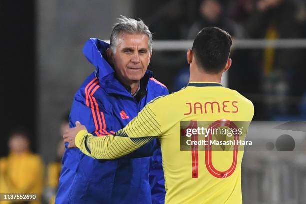 Carlos Queiroz,coach and James Rodriguez of Colombia shake hands during the international friendly match between Japan and Colombia at Nissan Stadium...