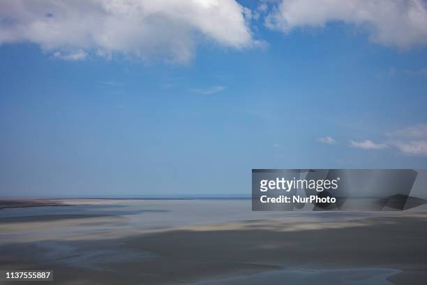 Mont Saint Michel, Normandy, France, March 28, 2019. The bay of Mont Saint Michel in the morning on a clear day from the abbey. Mont Saint Michel,...