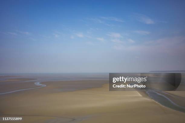 Mont Saint Michel, Normandy, France, March 28, 2019. The bay of Mont Saint Michel in the morning on a clear day from the abbey. Mont Saint Michel,...