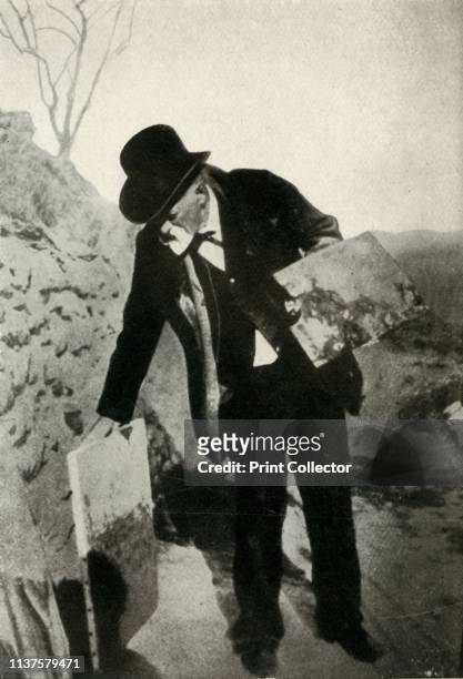 Cézanne with painting and palette, circa 1900, . The French painter Paul Cézanne at work towards the end of his life. From "The Saturday Book",...