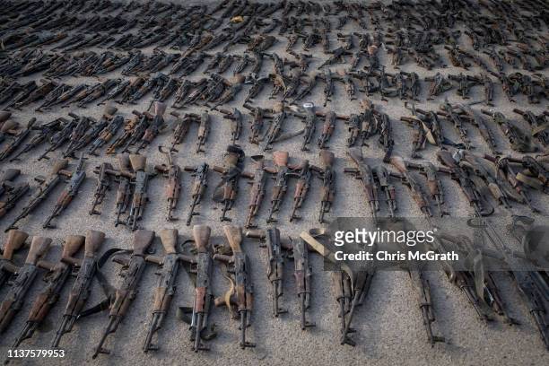 Seized ISIL weapons that were found in the last stronghold of the extremist group are displayed at an SDF base on March 22, 2019 outside Al Mayadin,...