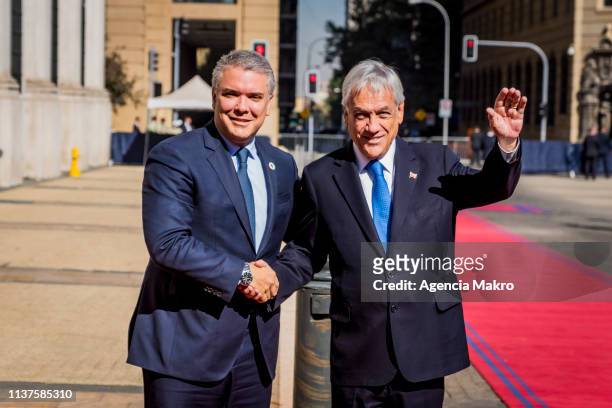 President of Chile Sebastián Piñera shakes hands with President of Colombia Iván Duque prior to the meeting of Presidents of South America also...
