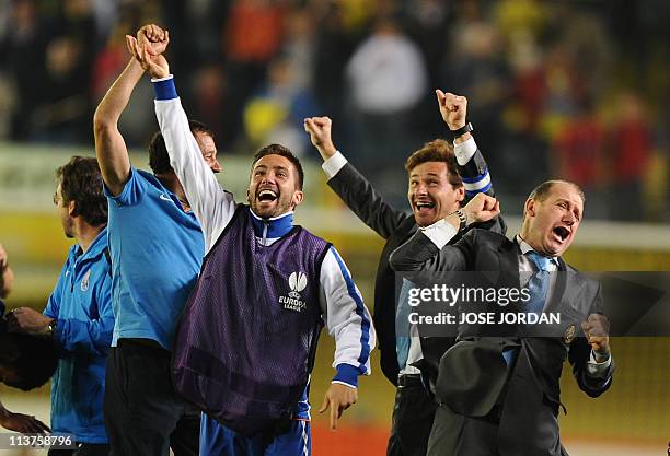 Porto's coach Andre Villas Boas celebrates with teammates after the UEFA Europa League semi-final second leg football match between Villarreal and...