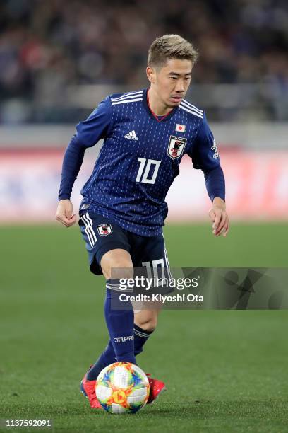 Shinji Kagawa of Japan in action during the international friendly match between Japan and Colombia at Nissan Stadium on March 22, 2019 in Yokohama,...