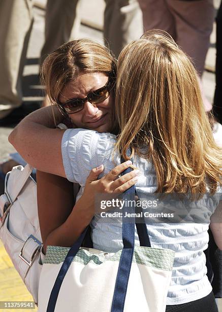 Family members of the victims of the September 11 terror attacks console one another during the ceremony to commemorate the fourth anniversary of the...