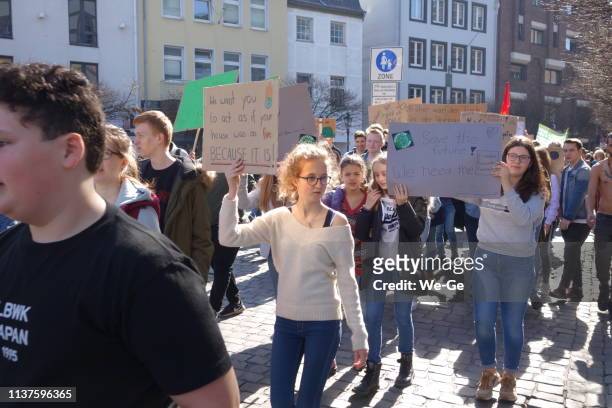 #fridaysforfuture: pupils 
protest against climate change - public workers strike in north rhine westpahalia stock pictures, royalty-free photos & images
