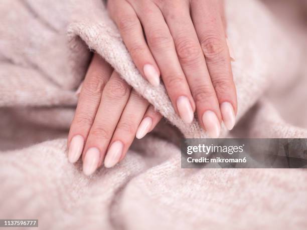 close-up of woman fingers with nail art manicure - ombré imagens e fotografias de stock