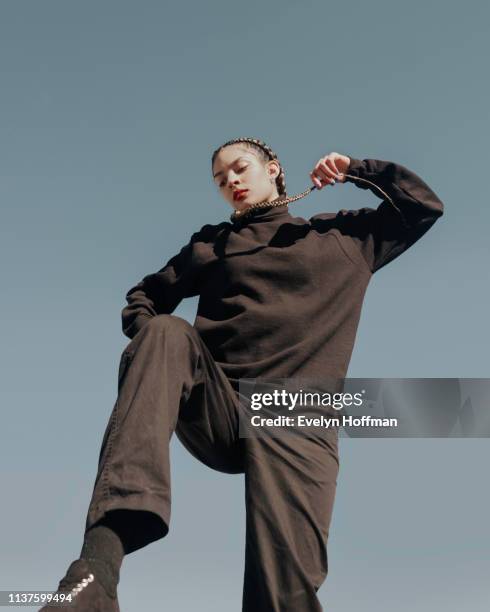 Female Model photographed against sky backdrop