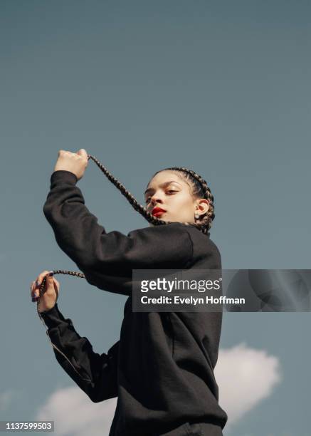 Female Model photographed against sky backdrop